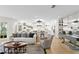 Open concept living area featuring a modern kitchen, cozy living room, and a dining area perfect for entertaining at 4810 W San Miguel St, Tampa, FL 33629