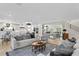 Open concept living area featuring a modern kitchen, cozy living room, and a dining area perfect for entertaining at 4810 W San Miguel St, Tampa, FL 33629