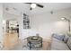 Cozy living room with tiled floors, a built-in bookcase, and comfortable seating at 4810 W San Miguel St, Tampa, FL 33629