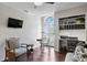Comfortable office space featuring a built-in desk, hardwood floors and a peaceful seating area at 4810 W San Miguel St, Tampa, FL 33629