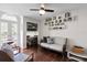 Comfortable office space featuring a built-in desk, hardwood floors and a peaceful seating area at 4810 W San Miguel St, Tampa, FL 33629