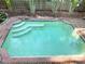 Refreshing backyard pool with clear water and easy access steps for a relaxing swim at 4810 W San Miguel St, Tampa, FL 33629