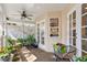 Charming porch area with comfortable seating and views of the lush greenery at 4810 W San Miguel St, Tampa, FL 33629