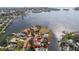 Aerial view of waterfront property with lush landscaping and panoramic water views in desirable neighborhood at 4811 Paradise S Way, St Petersburg, FL 33705