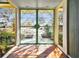 Unique front entrance with diamond-patterned glass doors and terracotta tile flooring at 4811 Paradise S Way, St Petersburg, FL 33705