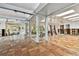 Bright, open living room with tile flooring, floor-to-ceiling windows, and modern ceiling fans at 4811 Paradise S Way, St Petersburg, FL 33705