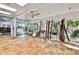 Large room with tile floors and lots of windows with natural light at 4811 Paradise S Way, St Petersburg, FL 33705