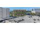 Elevated view of residential buildings, parking areas, and waterfront scenery in a coastal community at 5701 Mariner St # 606, Tampa, FL 33609