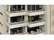 Multiple levels of spacious balconies that include tables, chairs and planters at 5701 Mariner St # 606, Tampa, FL 33609