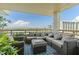 Inviting balcony with comfortable seating, offering stunning waterfront views and tranquil outdoor living space at 5701 Mariner St # 606, Tampa, FL 33609