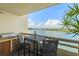 Balcony with seating, a grill, and scenic waterfront views at 5701 Mariner St # 606, Tampa, FL 33609