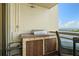 Outdoor balcony with a grill and seating area overlooking the water at 5701 Mariner St # 606, Tampa, FL 33609