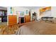 Well-lit bedroom with wood flooring, neutral walls, walk-in closet, and various wooden furnishings at 5701 Mariner St # 606, Tampa, FL 33609