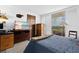 Bedroom featuring balcony access, with a comfy bed, and TV for relaxing evenings at 5701 Mariner St # 606, Tampa, FL 33609
