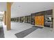 Elegant building entrance with double doors and decorative plants and seating at 5701 Mariner St # 606, Tampa, FL 33609