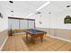 Well-lit game room featuring a full-size pool table for recreation and leisure activities at 5701 Mariner St # 606, Tampa, FL 33609