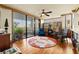 Bright living room featuring hardwood floors, comfortable seating, and an outdoor balcony at 5701 Mariner St # 606, Tampa, FL 33609