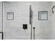 This shower has marble tiling and black fixtures at 5701 Mariner St # 606, Tampa, FL 33609