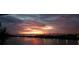 Expansive water views meet a dramatic colorful sunset in this photo taken from a condominium balcony at 5701 Mariner St # 606, Tampa, FL 33609