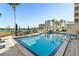 Inviting rectangular pool with ample seating, umbrellas and building views at 5701 Mariner St # 606, Tampa, FL 33609