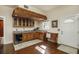 Custom bar area featuring unique wood details, granite countertops, wine cooler and natural lighting at 6342 5Th N Ave, St Petersburg, FL 33710