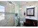 Beautiful bathroom featuring glass shower, modern fixtures and earth-toned color palette at 6342 5Th N Ave, St Petersburg, FL 33710