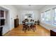 Elegant dining room with hardwood floors, bright windows, and a decorative chandelier for a stylish ambiance at 6342 5Th N Ave, St Petersburg, FL 33710