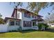 Charming two-story home with lush green lawn and landscaped surroundings at 6342 5Th N Ave, St Petersburg, FL 33710