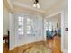 Inviting foyer featuring hardwood floors, elegant entry door, and views into the living space at 6342 5Th N Ave, St Petersburg, FL 33710