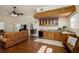 Living room with custom wet bar including unique wood detail, granite countertops, and a wine cooler at 6342 5Th N Ave, St Petersburg, FL 33710