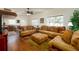 Inviting living room featuring hardwood floors, plentiful seating, and large windows for natural light at 6342 5Th N Ave, St Petersburg, FL 33710