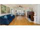 Elegant living room with hardwood floors, fireplace, and stylish blue sofa at 6342 5Th N Ave, St Petersburg, FL 33710