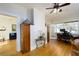 Bright open room with hardwood floors and a doorway to another room with a blue couch at 6342 5Th N Ave, St Petersburg, FL 33710