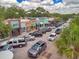 Charming street view showcasing local shops and eateries with colorful facades and street parking at 1003 De Soto Dr # 2, Dunedin, FL 34698