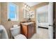 Bathroom has a modern toilet and sink, vanity with lots of natural light at 1024 Brae Ct, Palm Harbor, FL 34684