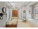Bright bathroom with a double vanity with granite countertops, soaking tub and tile flooring at 11158 Warm Wind Way, Weeki Wachee, FL 34613