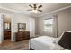Bedroom featuring a dresser, hardwood floors, and view to the property at 11158 Warm Wind Way, Weeki Wachee, FL 34613