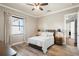 Bedroom with a neutral color palette, natural light, and wood flooring at 11158 Warm Wind Way, Weeki Wachee, FL 34613
