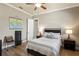 Bedroom featuring wood floors, an open floorplan, and neutral colors at 11158 Warm Wind Way, Weeki Wachee, FL 34613