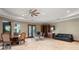 Well-lit bonus room with dining and seating areas, tile floors, and built-in cabinets at 11158 Warm Wind Way, Weeki Wachee, FL 34613