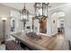 Open dining area adjacent to living spaces featuring decorative pendant lights at 11158 Warm Wind Way, Weeki Wachee, FL 34613