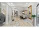 Spacious dining room with travertine floors, high ceilings, and elegant light fixtures at 11158 Warm Wind Way, Weeki Wachee, FL 34613