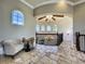 Upper floor foyer with chandelier, seating area, and arch window at 11158 Warm Wind Way, Weeki Wachee, FL 34613