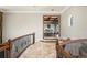 Foyer view with railing detail, seating, and view of office at 11158 Warm Wind Way, Weeki Wachee, FL 34613