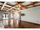 Game room with wooden ceiling beams, ping pong table, and hardwood floors at 11158 Warm Wind Way, Weeki Wachee, FL 34613