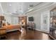 Spacious bedroom featuring dark hardwood floors, and decorative lighting fixtures at 11158 Warm Wind Way, Weeki Wachee, FL 34613