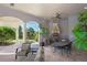Elegant outdoor kitchen and dining area with a built-in grill and comfortable seating at 11158 Warm Wind Way, Weeki Wachee, FL 34613