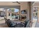 Inviting outdoor living area featuring a fireplace, spiral staircase and views of the pool at 11158 Warm Wind Way, Weeki Wachee, FL 34613