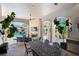 Spacious outdoor living area with a dining table, fireplace, and views of the pool at 11158 Warm Wind Way, Weeki Wachee, FL 34613