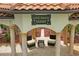 Inviting outdoor living space featuring comfortable seating beneath a covered resort-style patio at 11158 Warm Wind Way, Weeki Wachee, FL 34613